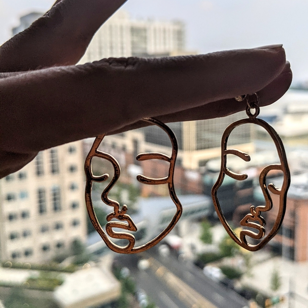 Gold abstract face earrings